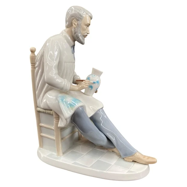 Spanish Porcelain Figurine of Seated Ceramic Painter - Image 5