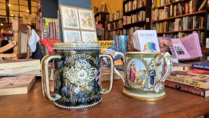Three-handled Anglo-Boer War mugs (tygs) at Midlands Books, commemorating the Boer War with an embossed Queen Victoria and Union Jack.