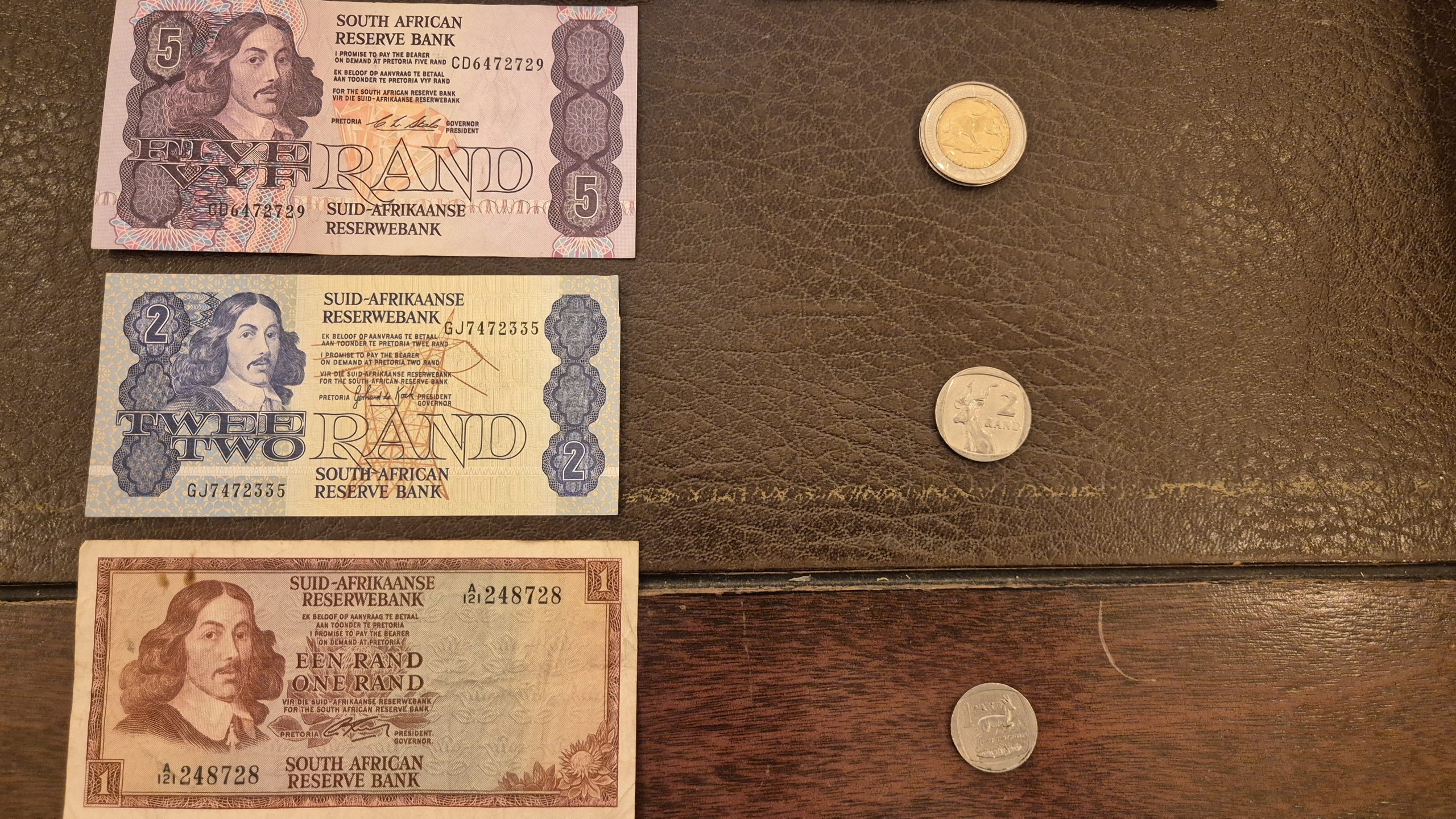 Old South African Reserve Bank R5, R2 and R1 notes with R5, R2 and R1 coins, graded at Midlands Books