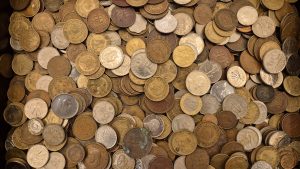 A selection of old South African coins laid out to check their collectable value